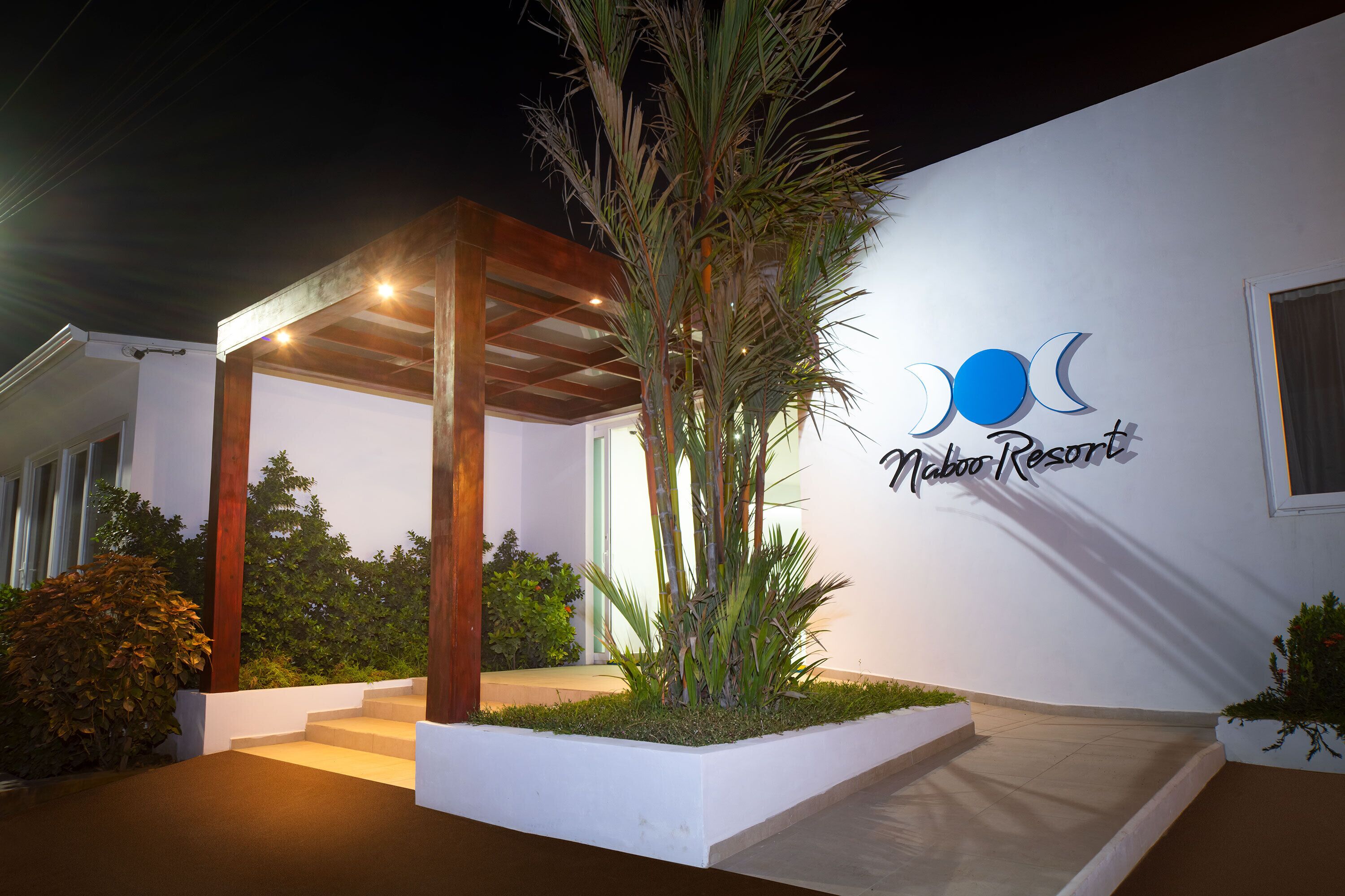 A modern building with a sign reading "Naboo Resort."