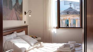 Premium bedding, desk, laptop workspace, blackout drapes