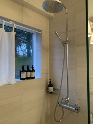 Bathtub, hair dryer, towels, soap