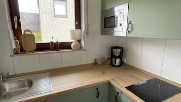 Fridge, microwave, stovetop, coffee/tea maker