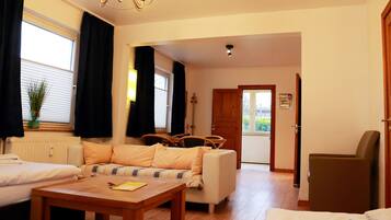 Comfort Apartment (1C incl. Cleaning Fee 35 EUR) | Living area | 32-inch LED TV with cable channels, TV