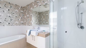 Bathtub, hair dryer, towels, soap