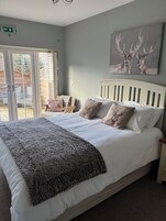 Deluxe Double Room (Room 2) | Iron/ironing board, bed sheets