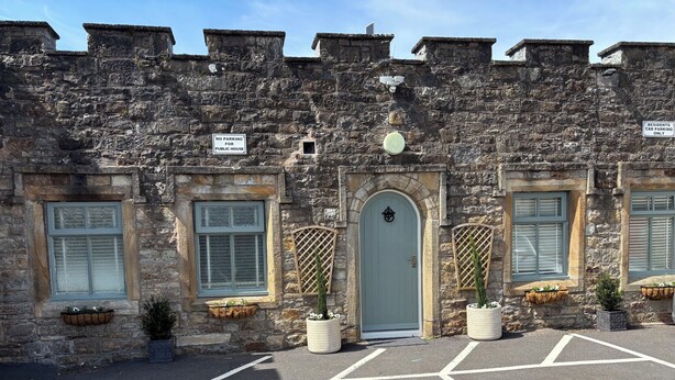 A stone building with a sign indicating no parking for public use. - Blenkinsopp Castle Inn (Brampton)