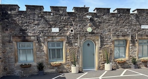 A stone building with a sign indicating no parking for public use. - Blenkinsopp Castle Inn (Brampton)