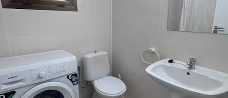 Bathtub, hair dryer, towels