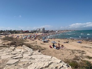 On the beach, sun-loungers, beach towels