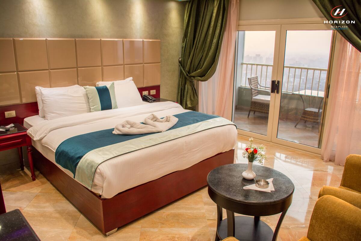 Deluxe Double or Twin Room, River View | In-room safe, desk, laptop workspace, blackout drapes