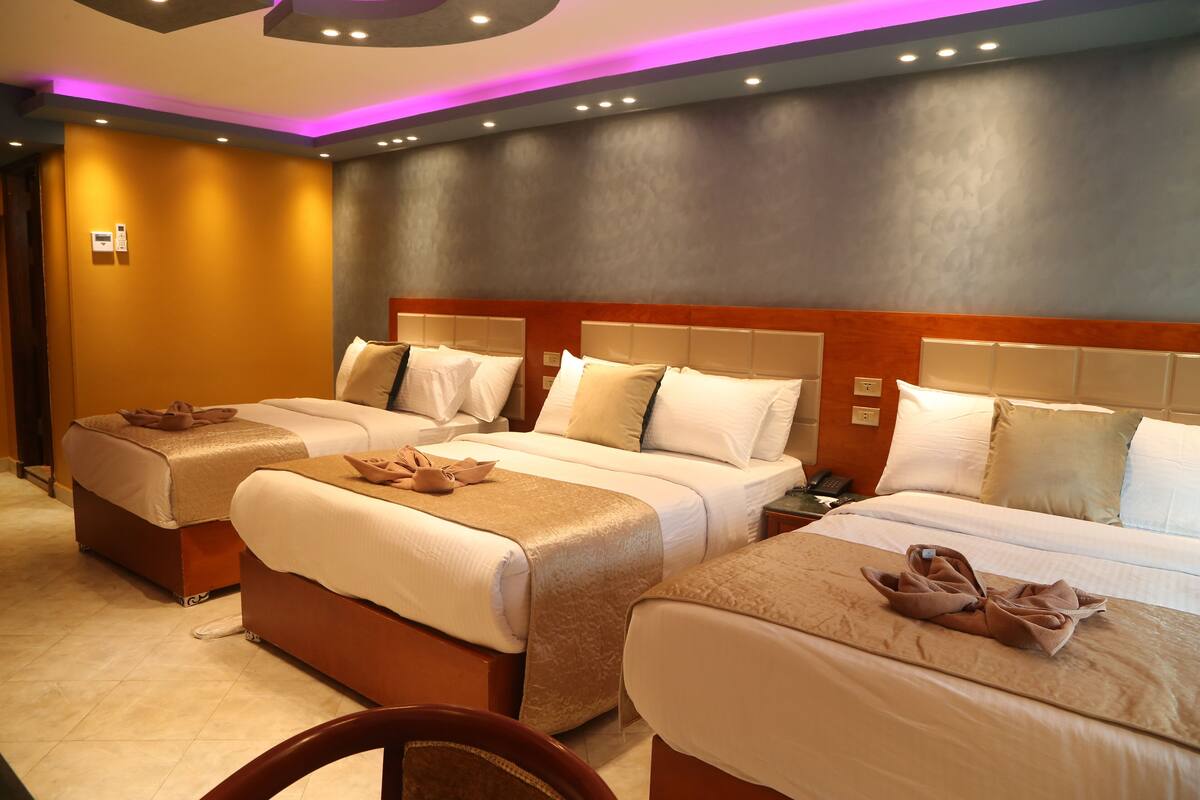 Superior Triple Room | In-room safe, desk, laptop workspace, blackout drapes