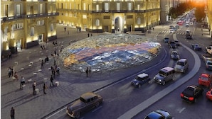 A large, circular plaza with a glass roof, surrounded by classical buildings with balconies. - Naporà (Naples)