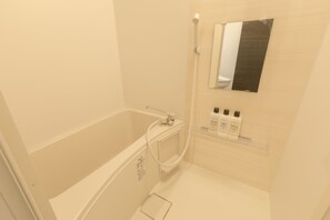 Separate tub and shower, free toiletries, hair dryer, slippers