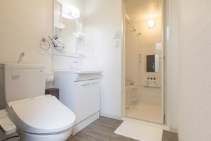 Separate tub and shower, free toiletries, hair dryer, slippers