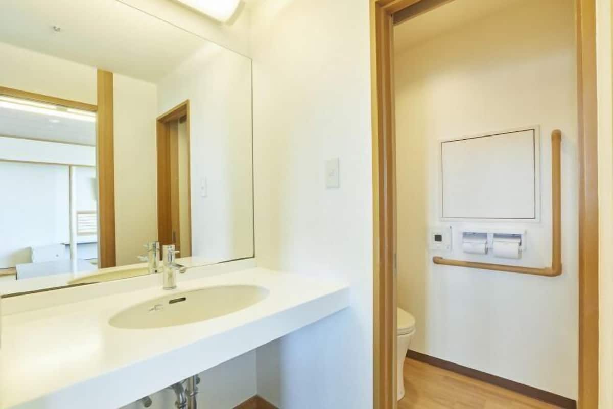 Bathroom | Hair dryer, slippers, towels