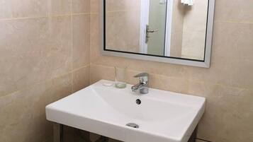 Shower, free toiletries, hair dryer, slippers