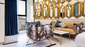 A modern living room with a sofa, a coffee table, and a decorative metal partition. - Forestar (Seoul)