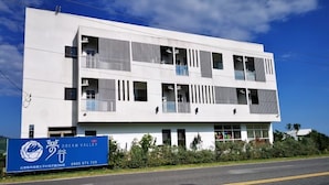 A modern building with a signboard for Dream Valley. - Dream Valley (Beinan)