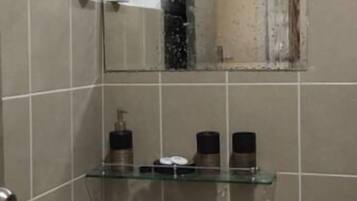 Combined shower/tub, hair dryer, towels, soap