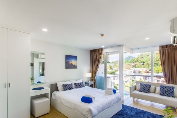 ดีลักซ์อพาร์ทเมนท์, 1 ห้องนอน | 1 ห้องนอน, ผ้าม่านกันแสง, Wi-Fi ฟรี, ผ้าปูที่นอน