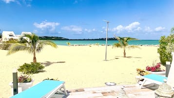 On the beach, sun loungers, beach towels