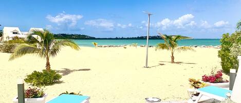 On the beach, sun loungers, beach towels