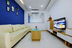 Apartment, River View | Living room | 43-inch Smart TV with digital channels, TV - Khanh Hoa Apartments (Nha Trang)