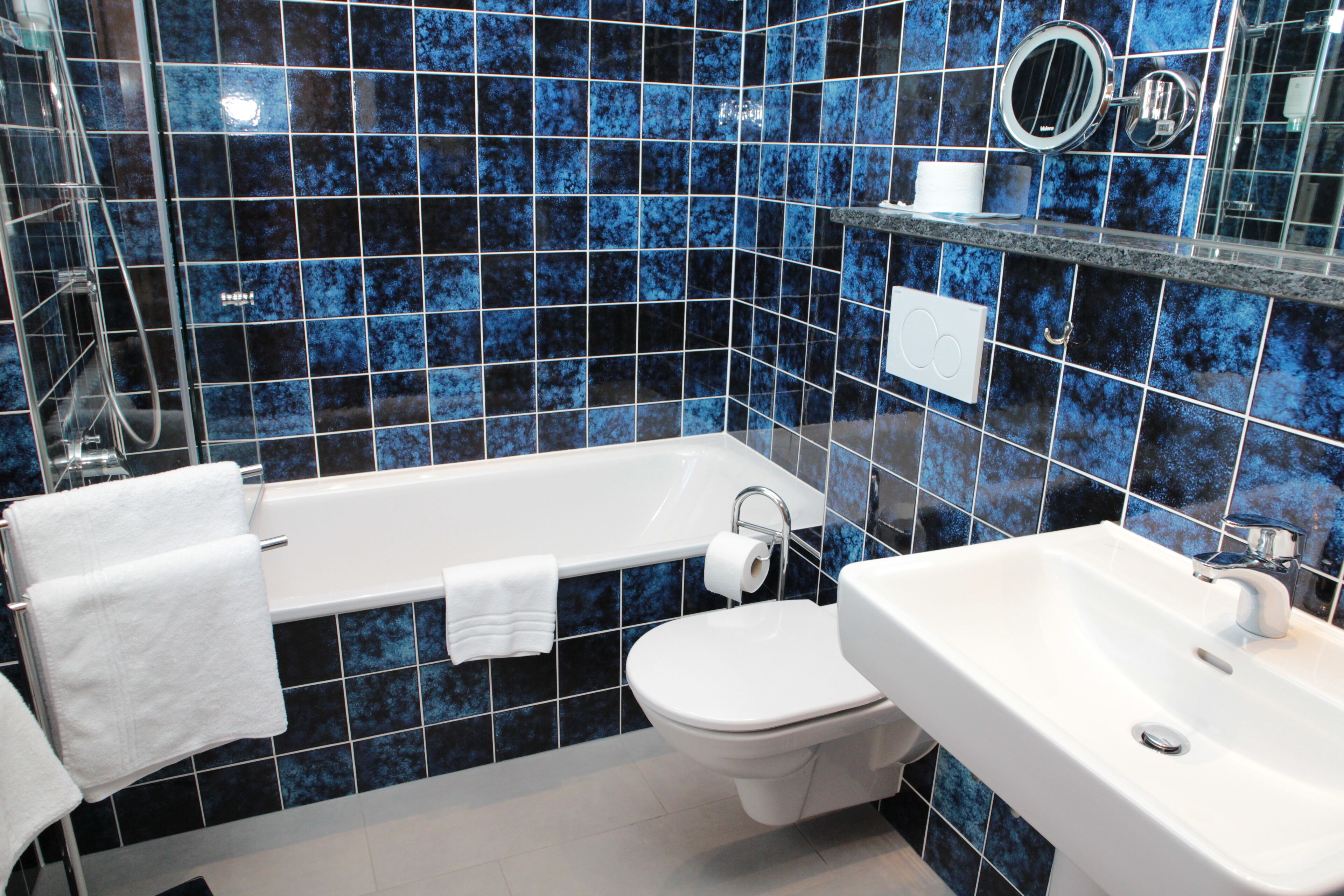 suite | bathroom | hair dryer, towels, soap, shampoo