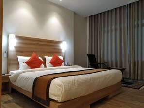 Deluxe Room | Egyptian cotton sheets, premium bedding, down comforters - Hotel SC Grand (Papumpare)