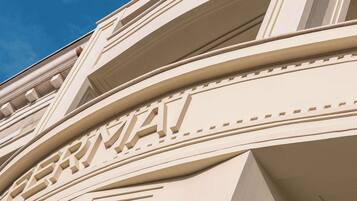 Geometric architectural feature adds depth and visual interest to the building's facade.