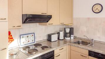 Fridge, stovetop, dishwasher, coffee/tea maker