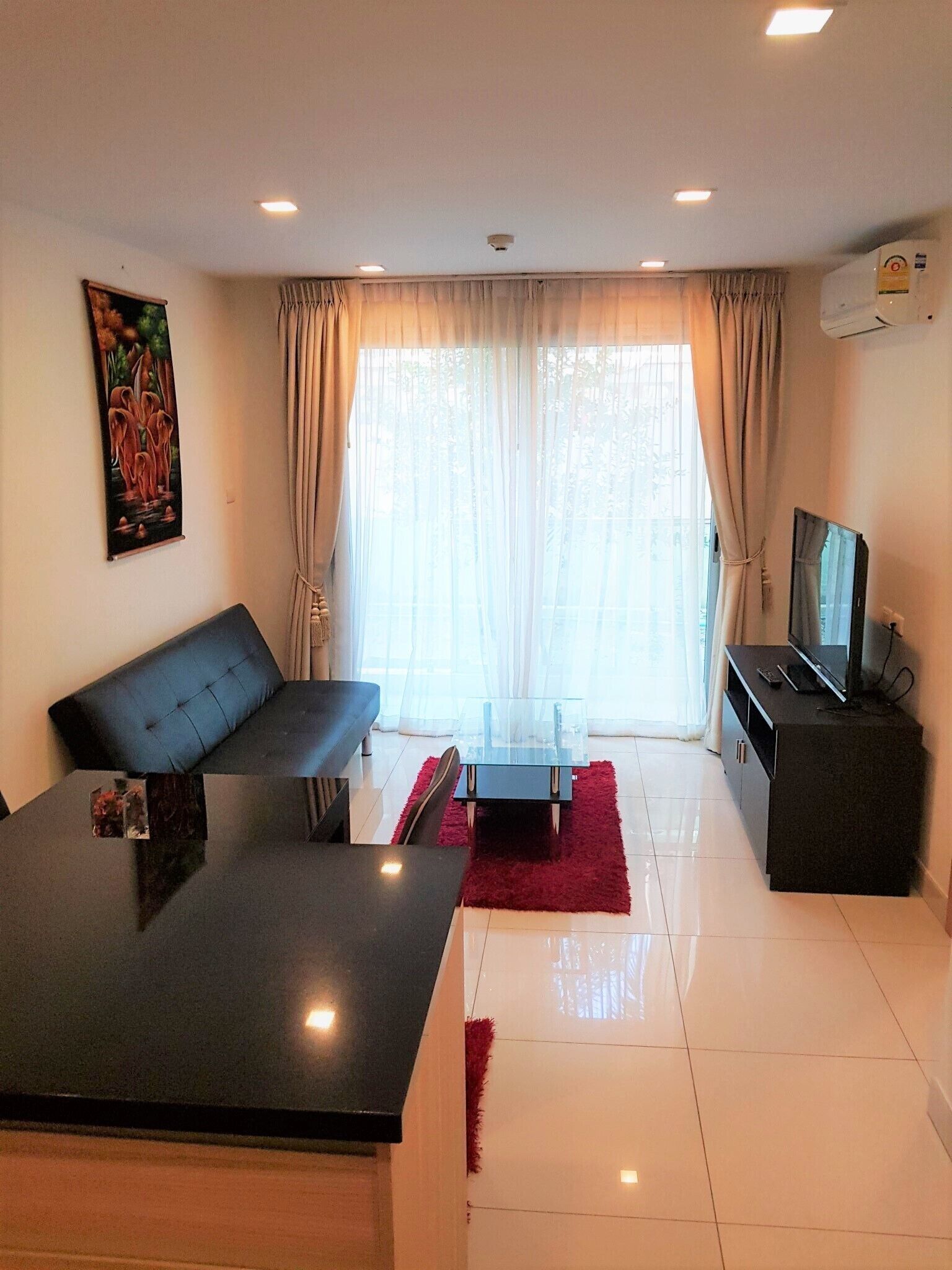 Apartment | Living area | 30-inch TV with digital channels