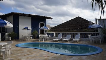 Outdoor pool, open 9:00 AM to 6:00 PM, pool umbrellas, pool loungers