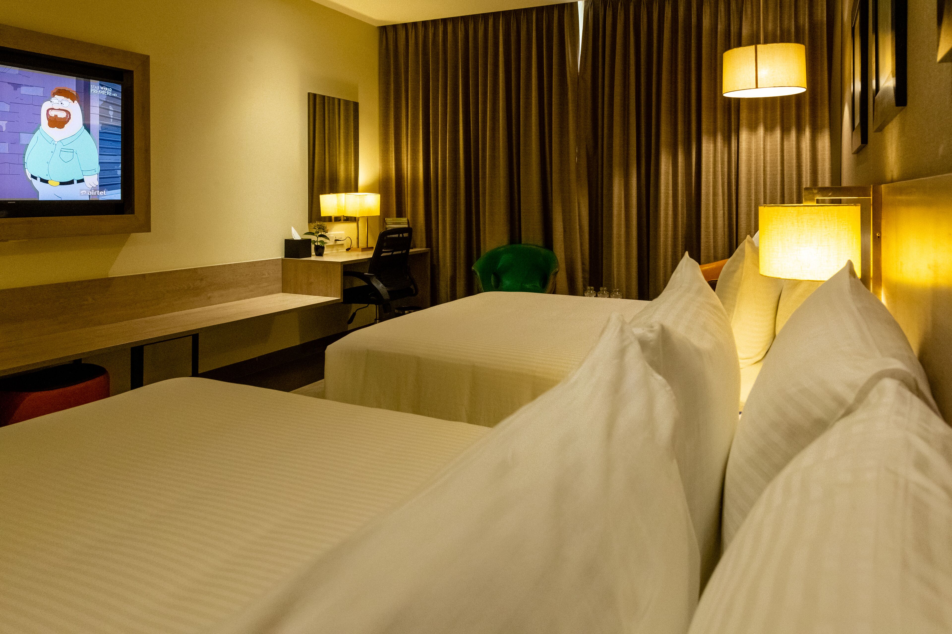 deluxe quadruple room, 2 queen beds, non smoking | 1 bedroom, hypo-allergenic bedding, minibar, in-room safe