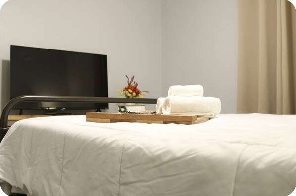 2 bedrooms, blackout curtains, iron/ironing board, travel cot