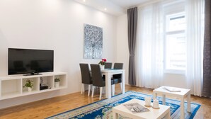 Apartment (1 Bedroom) | Living room | 32-inch TV with cable channels - Bright and Spacious Apartment in the City Center! (Zagreb)