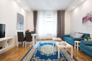Apartment (1 Bedroom) | Living room | 32-inch TV with cable channels