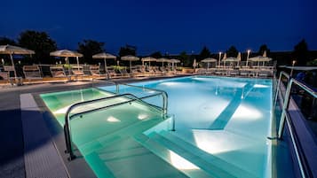 Seasonal outdoor pool, open 9:00 AM to 11:00 PM, pool umbrellas