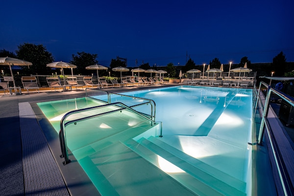 Seasonal outdoor pool, open 9:00 AM to 11:00 PM, pool umbrellas