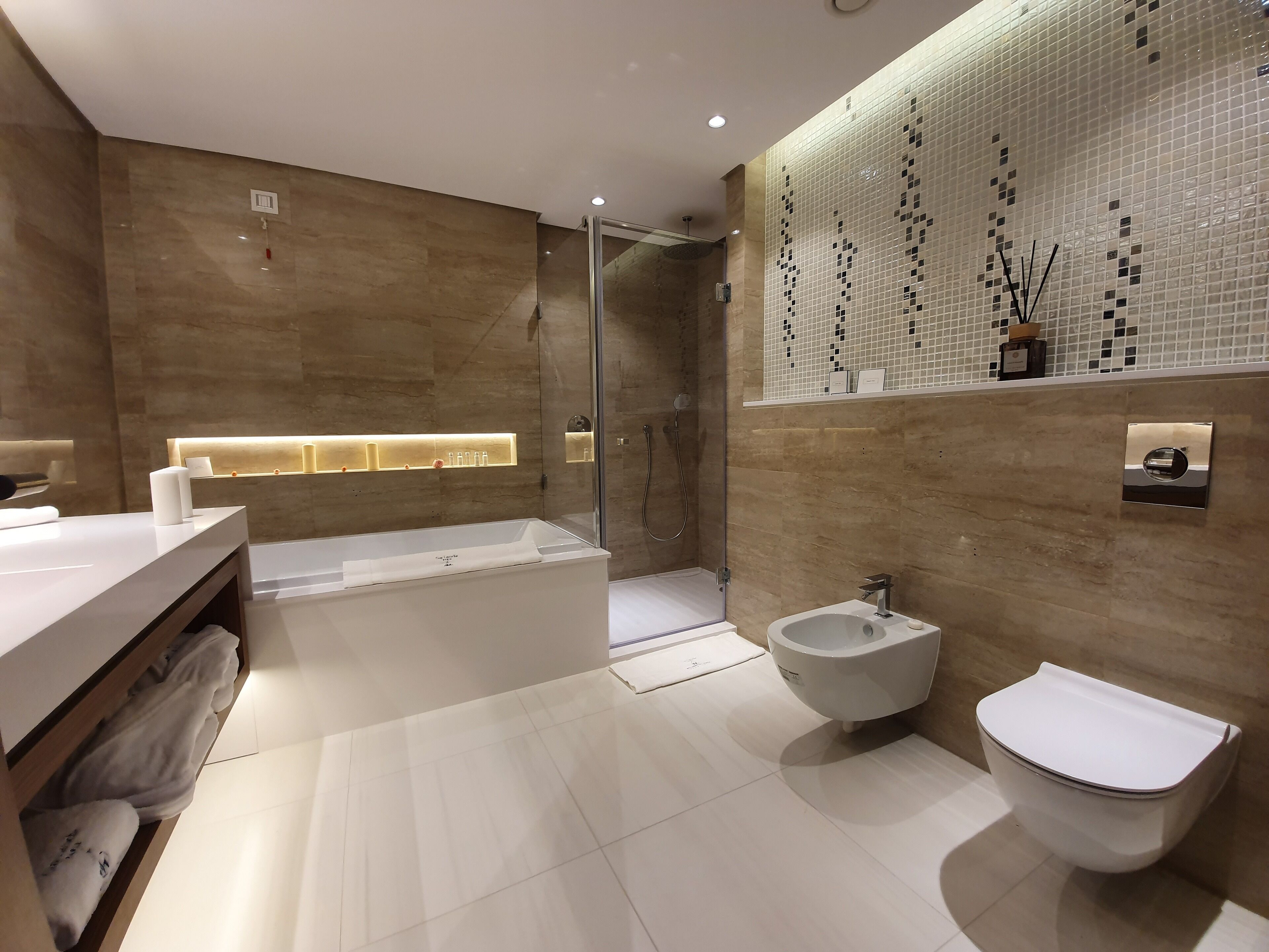 designer toiletries, hair dryer, bathrobes, slippers