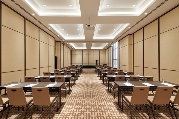 A conference room with a long table, chairs, and a projector screen at the front. - Four Points by Sheraton Kuala Lumpur, Chinatown (Kuala Lumpur)