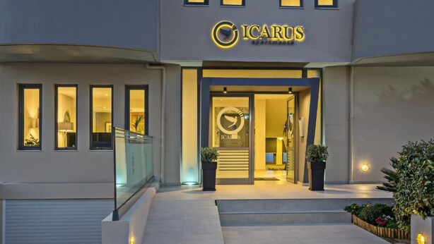 A modern building with a sign reading "ICARUS apartments." - Icarus Suite Apartments (Rethymno)