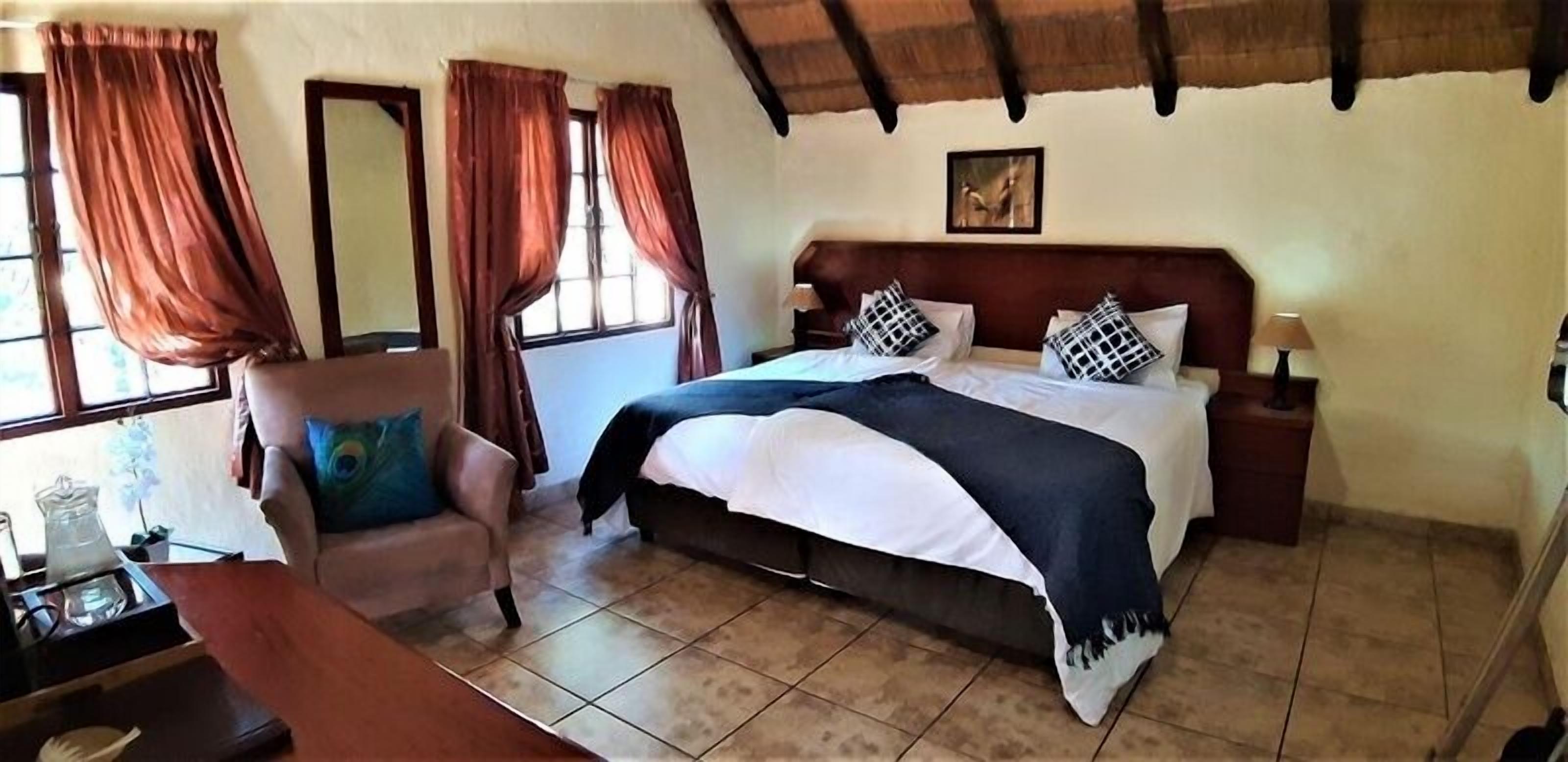 Desk, iron/ironing board, bed sheets