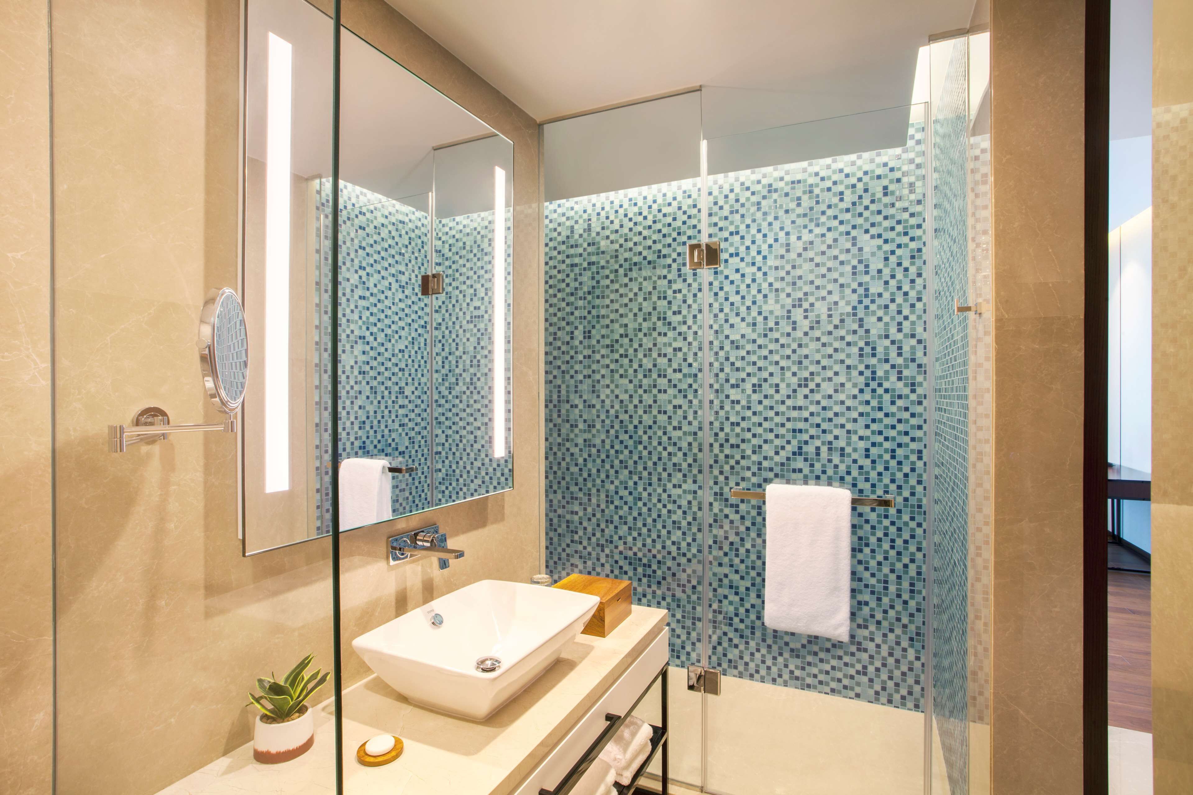 shower, rainfall showerhead, designer toiletries, hair dryer