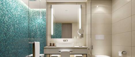 A modern bathroom with a glass shower enclosure, a large mirror, and a sink with a towel rack.