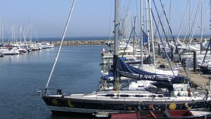A marina with multiple sailboats docked. - Luxurious apartment for 4 persons with parking directly in front of the terrace (Kühlungsborn-West)