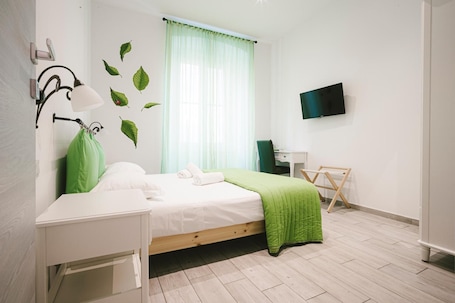 Desk, laptop workspace, blackout drapes, soundproofing