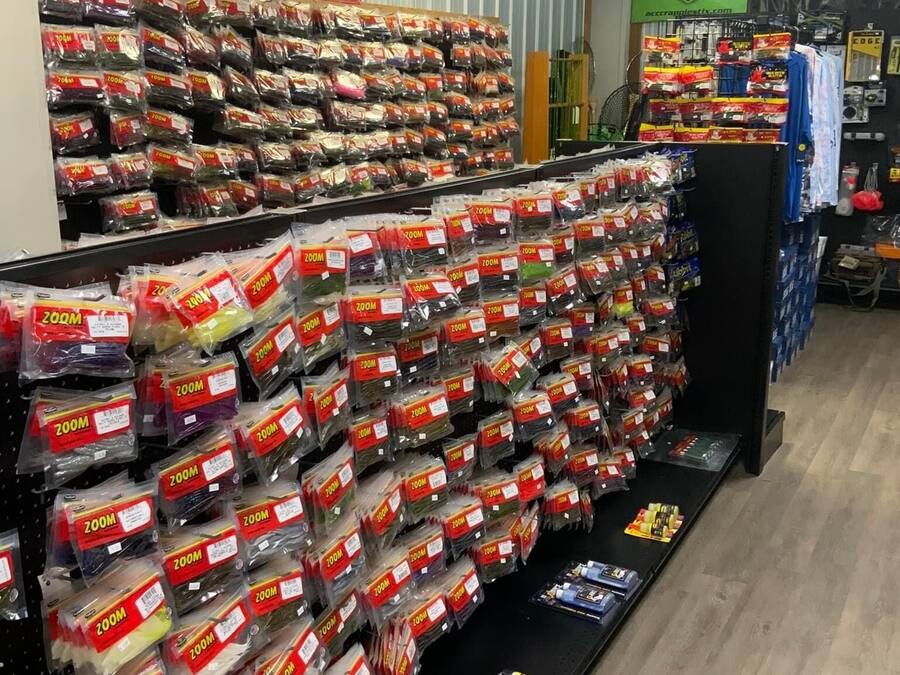 A store aisle with shelves stocked with 200M packages, a '200M' promotional banner, and a 'BoneHead' branded display.