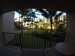 Enjoy a serene view of the lush garden from this balcony.