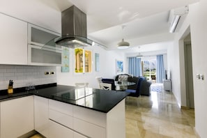 Fridge, microwave, stovetop, coffee/tea maker