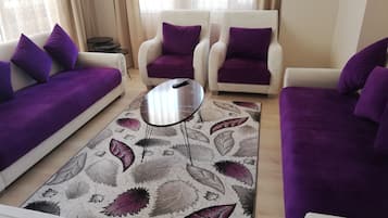 Business Apartment | Living room | 40-inch LCD TV with satellite channels, TV
