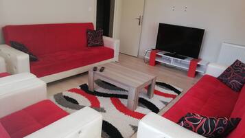 Apartment, 1 Bedroom, Partial Sea View | Living room | 40-inch LCD TV with satellite channels, TV